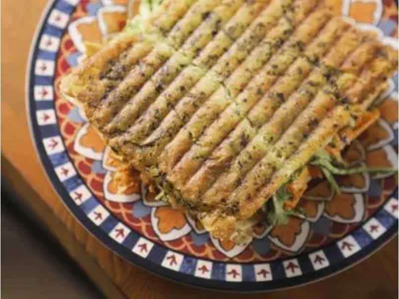 Southern North African Cilantro Sandwich in hand