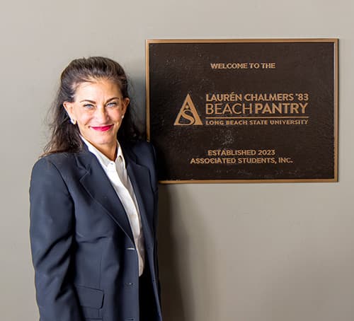 Lauren Chalmers in front of plaque